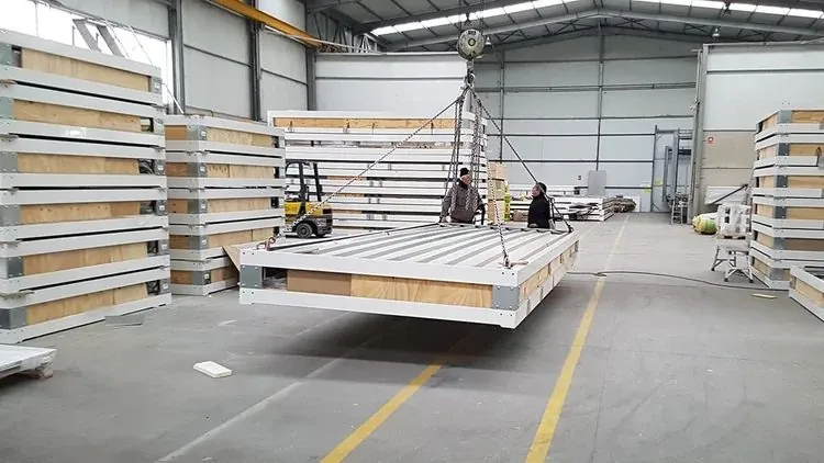 A floor cassette being lifted during assembly