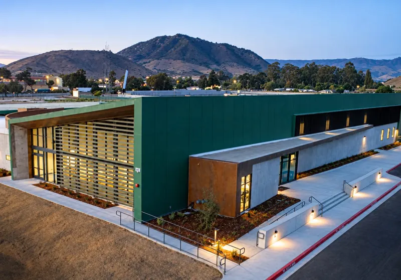 Pre-engineered steel community building at dusk