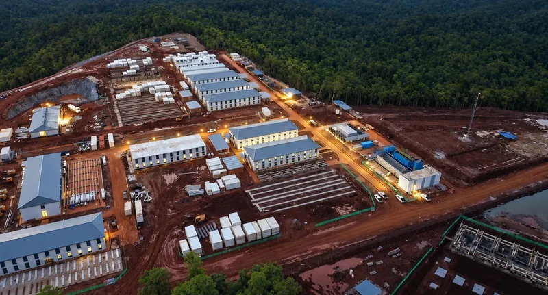 Aerial view of a modular camp cleared from forest at a remote mining site
